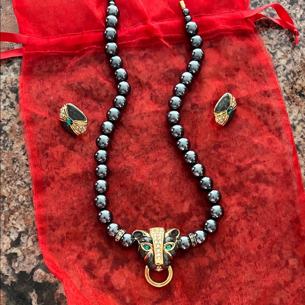 Elegant Black Beaded Necklace with Gold Elephant Pendant and matching earrings